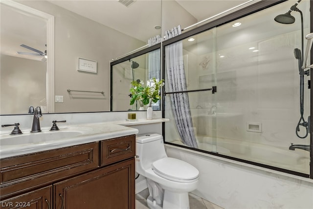 full bathroom featuring ceiling fan, toilet, shower / bath combo, vanity, and tile patterned floors