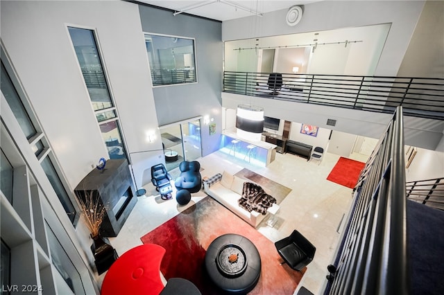 living room featuring a towering ceiling