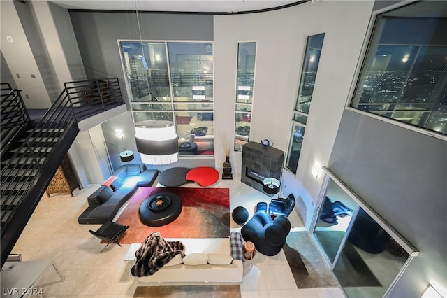 exercise room featuring light tile flooring