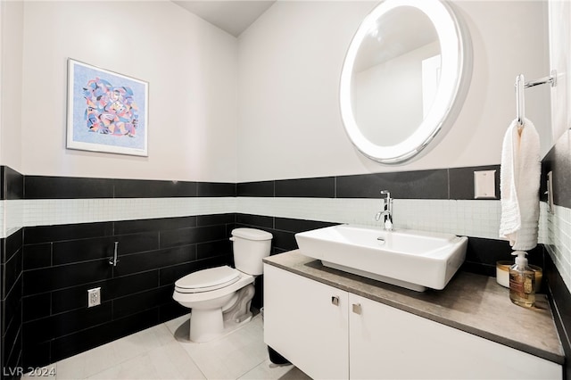 bathroom featuring tile walls, tasteful backsplash, tile floors, and toilet