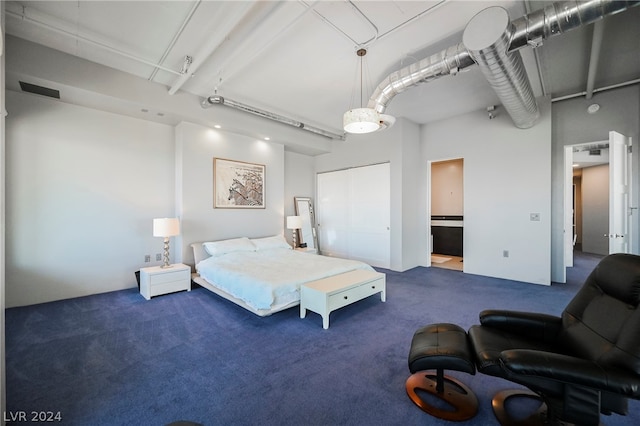 bedroom featuring dark colored carpet