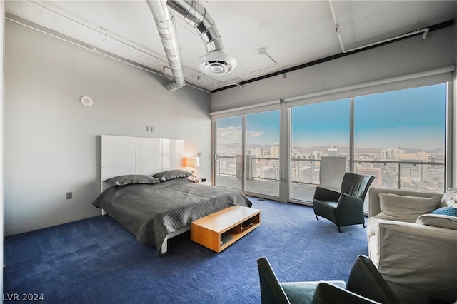 carpeted bedroom with multiple windows, access to exterior, and ceiling fan