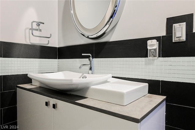 bathroom with tile walls and oversized vanity