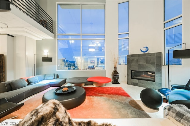 living room featuring a tile fireplace