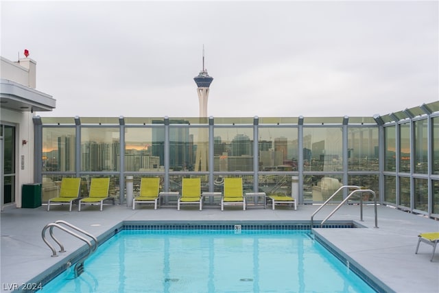 view of swimming pool featuring a patio