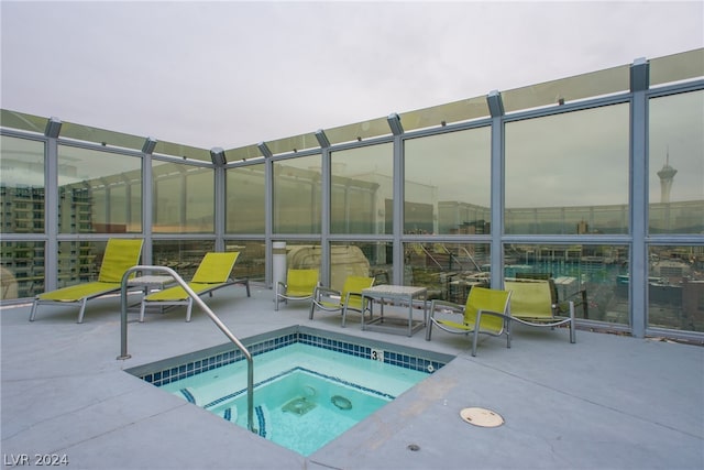 view of pool with a community hot tub and a patio