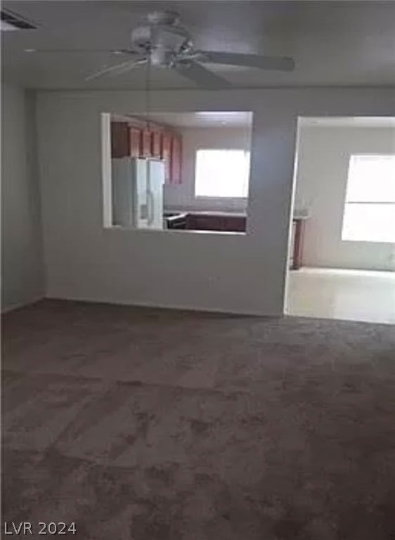 unfurnished room featuring ceiling fan