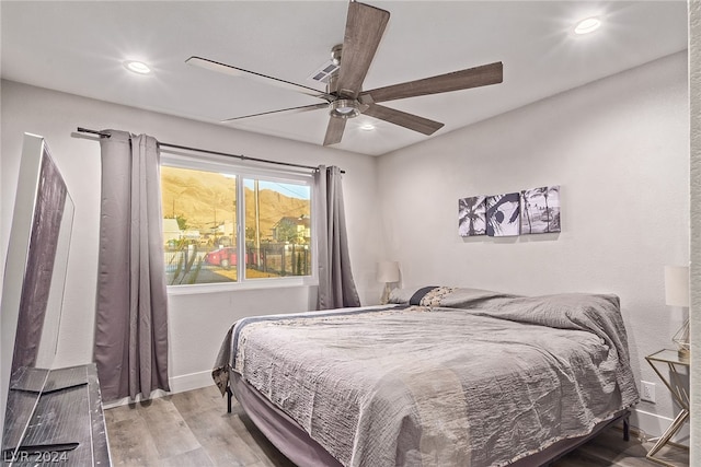 bedroom featuring recessed lighting, ceiling fan, baseboards, and wood finished floors