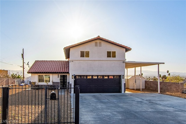 view of front of home with a garage, driveway, and stucco siding