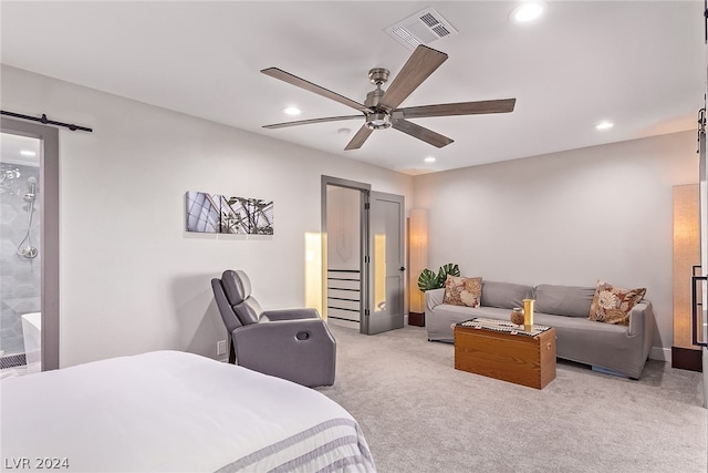 bedroom with light carpet, a barn door, visible vents, and recessed lighting