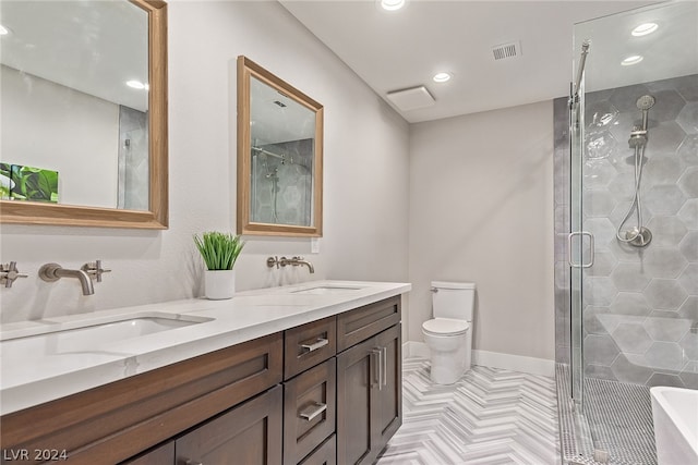 bathroom with double vanity, a stall shower, a sink, and visible vents