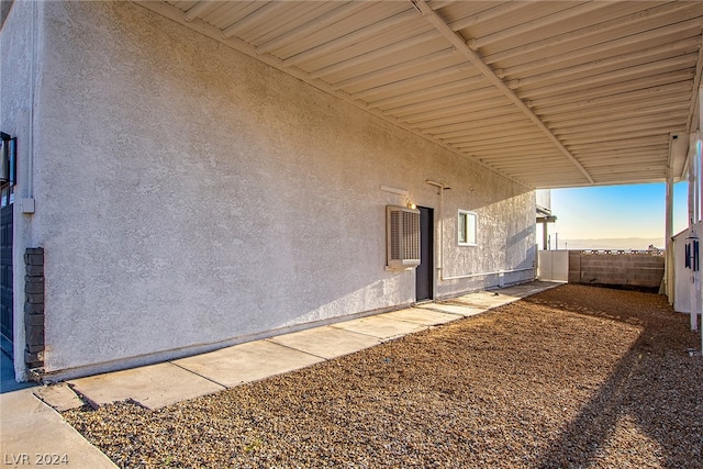 exterior space with fence and stucco siding