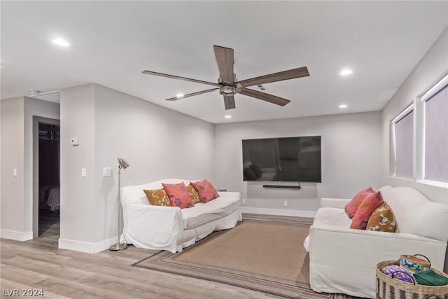 living area with baseboards, ceiling fan, light wood-type flooring, and recessed lighting