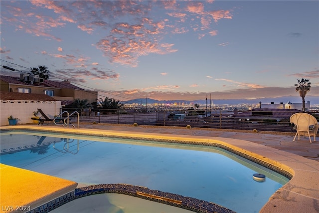 view of pool with a fenced in pool, a patio area, and fence