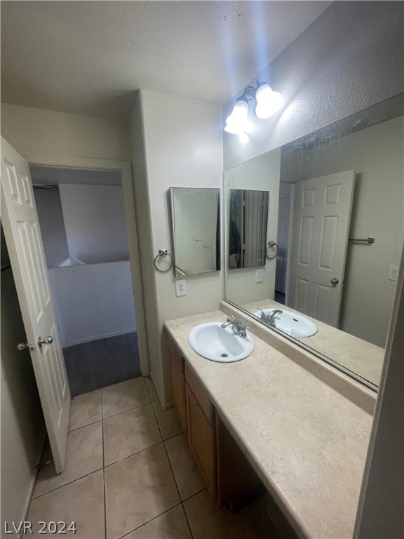 bathroom with vanity and tile patterned floors