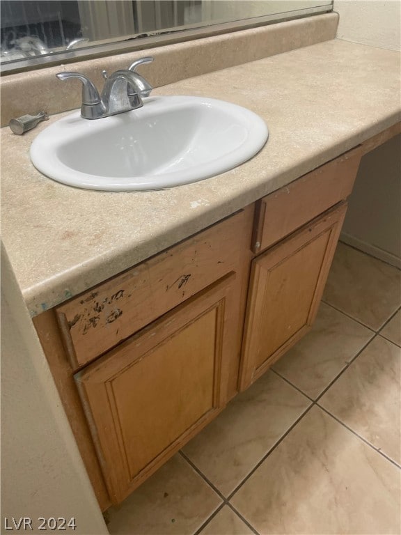 bathroom with vanity and tile patterned floors