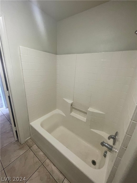 bathroom featuring bathing tub / shower combination and tile patterned floors