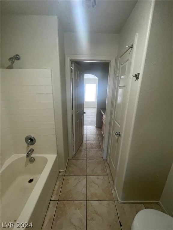 full bathroom featuring  shower combination, tile patterned floors, toilet, and vanity