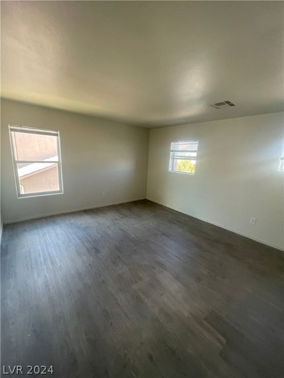 unfurnished room featuring hardwood / wood-style floors