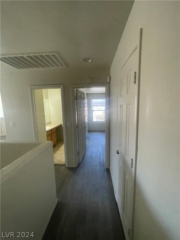 hallway with wood-type flooring