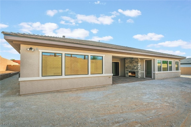 back of property with a patio area