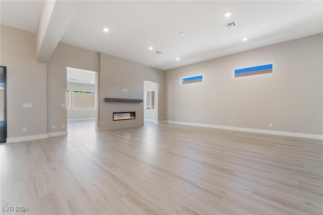 unfurnished living room featuring light hardwood / wood-style flooring