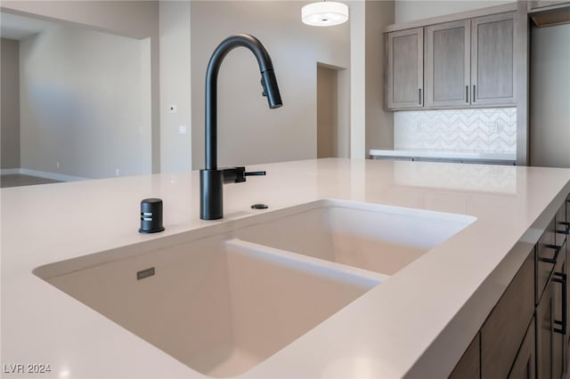 interior details with sink and tasteful backsplash