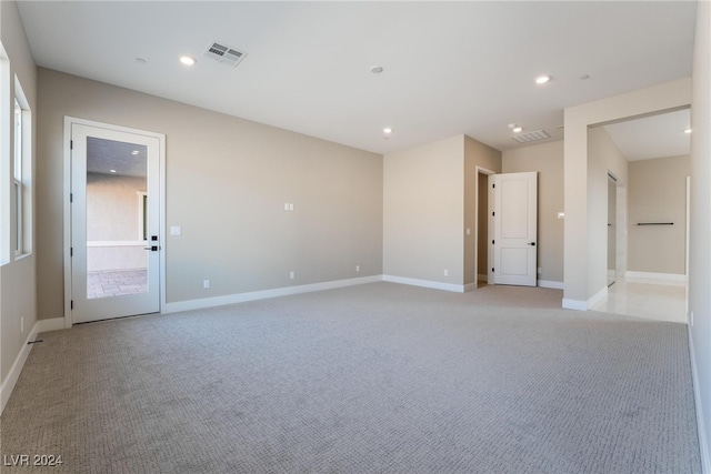 empty room featuring light colored carpet