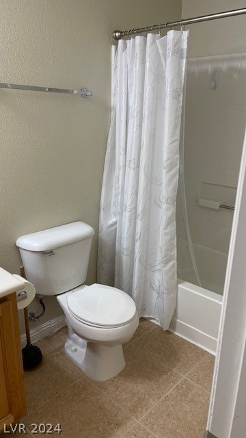 full bathroom with vanity, tile floors, toilet, and shower / bathtub combination with curtain