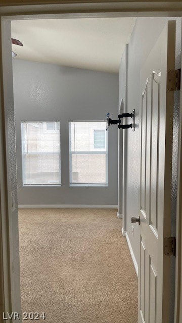 spare room with light colored carpet