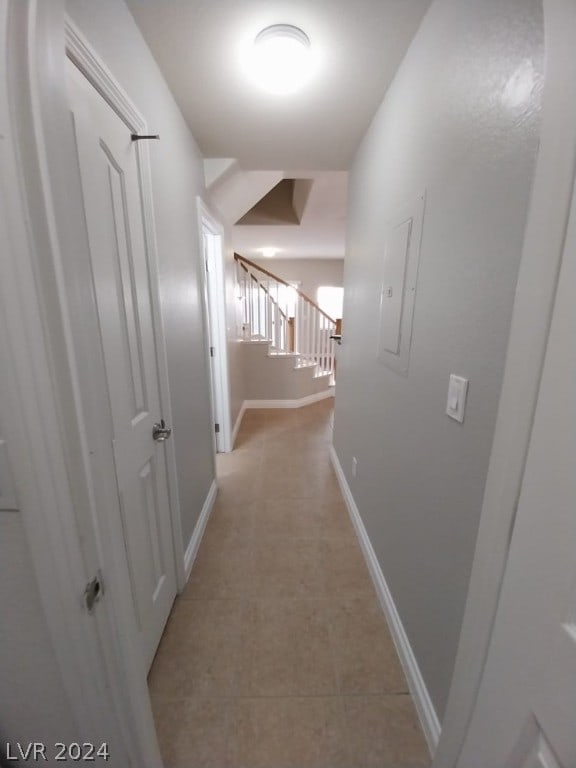 corridor featuring light tile floors