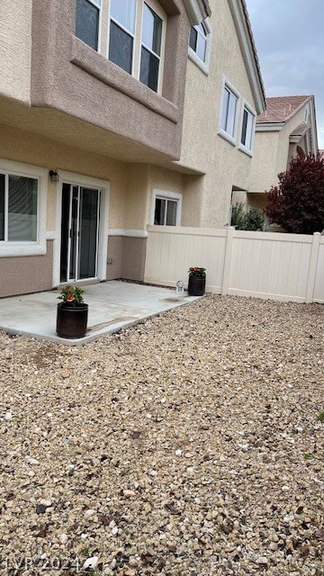 back of house with a patio area