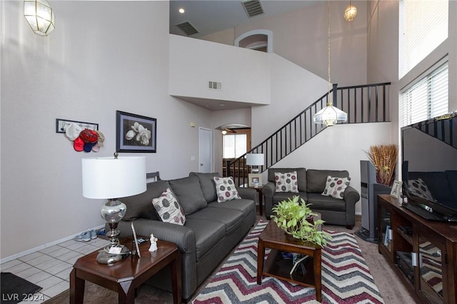 living area with visible vents, arched walkways, and stairway