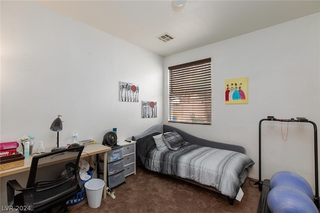 bedroom with dark colored carpet