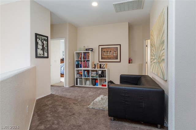 living area with carpet and visible vents