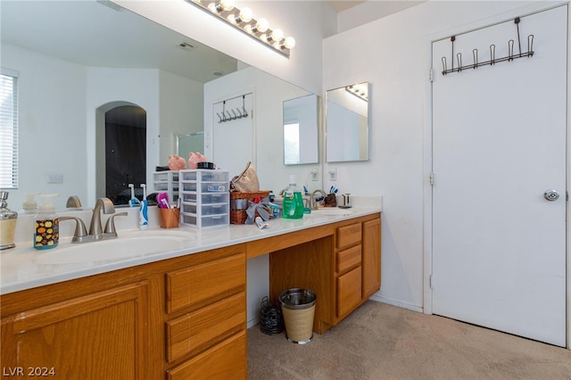 bathroom featuring carpet floors, visible vents, a sink, and double vanity