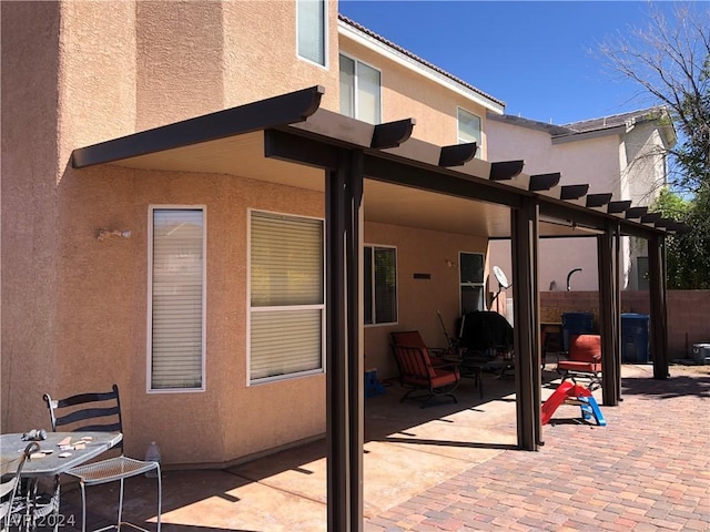 view of patio featuring fence