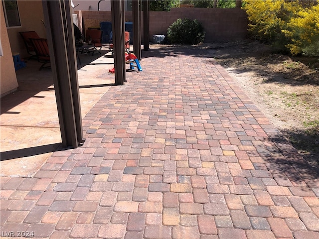 view of patio featuring fence