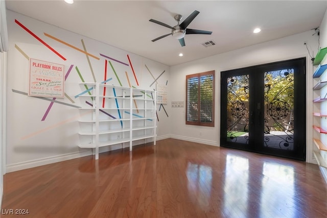 interior space with dark hardwood / wood-style floors, ceiling fan, and french doors