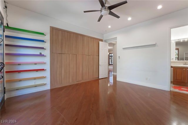 unfurnished bedroom featuring dark hardwood / wood-style flooring and ensuite bath