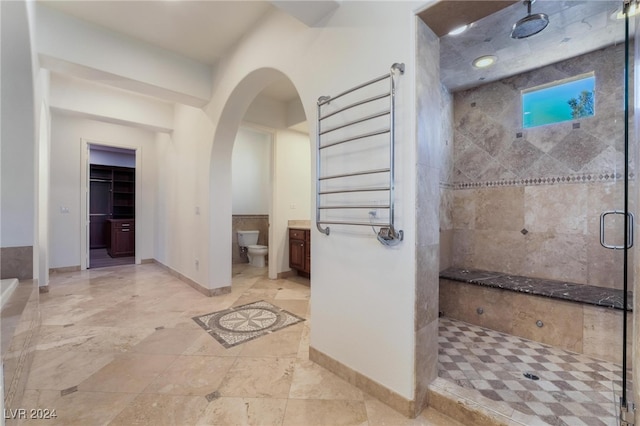 bathroom with toilet and walk in shower