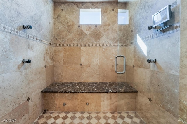 bathroom with tiled shower