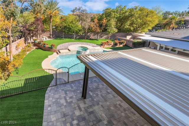 view of pool featuring an in ground hot tub, a yard, and a patio