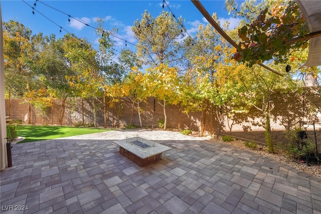 view of patio / terrace with a fire pit