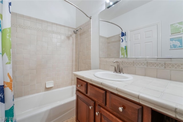 bathroom featuring vanity, backsplash, and shower / tub combo with curtain