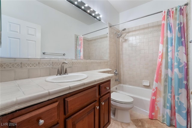 full bathroom featuring vanity, tile patterned flooring, toilet, shower / bath combo with shower curtain, and tile walls