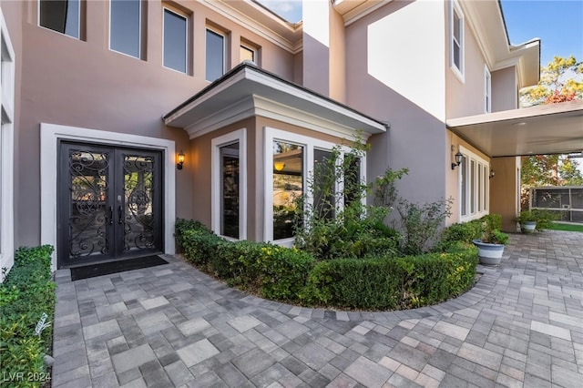 property entrance featuring french doors