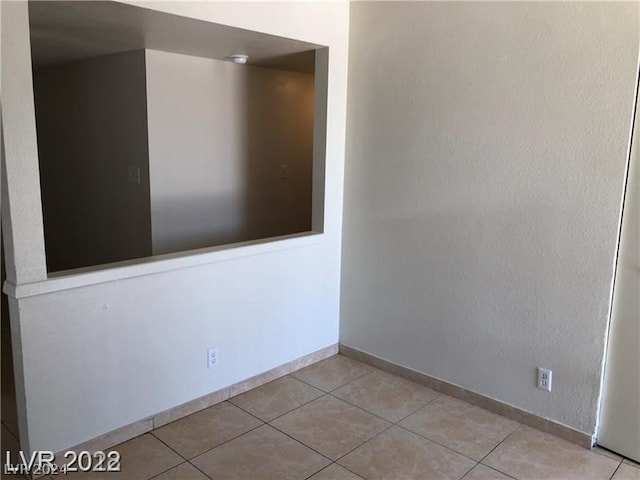 empty room with light tile flooring