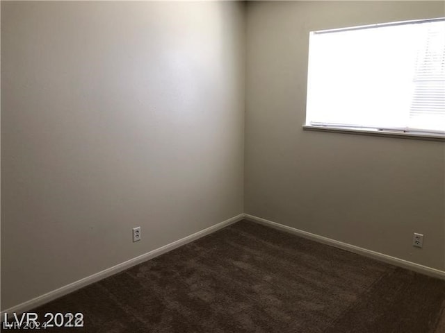 carpeted empty room with a wealth of natural light