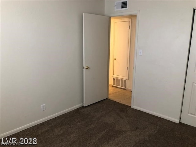 empty room featuring carpet flooring